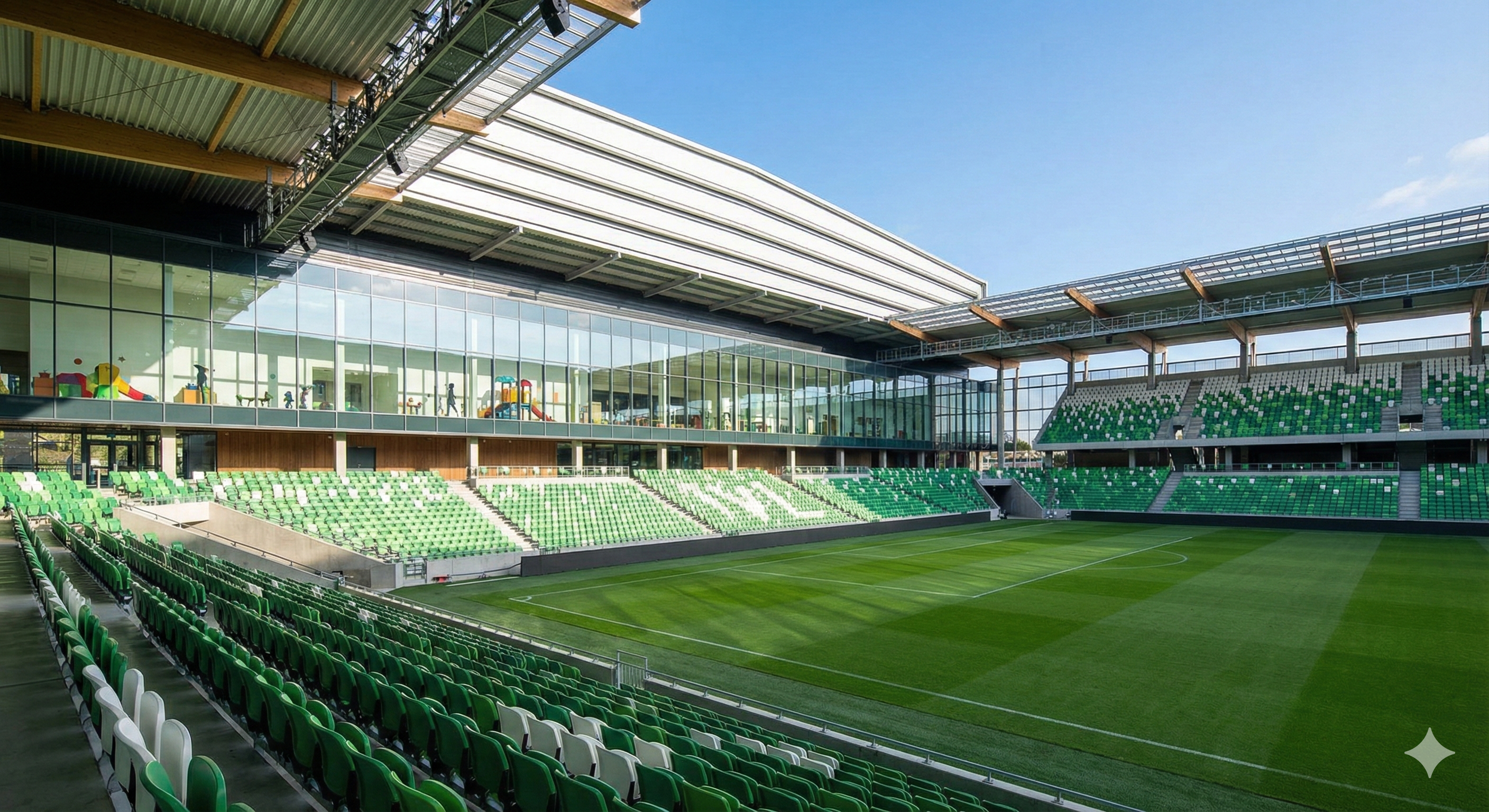 Stadium interior daytime view showing empty pitch with pristine green grass, retractable roof open to blue sky, modern seating in emerald green, childcare facility windows visible on upper level, sense of openness and versatility, professional architectural photography